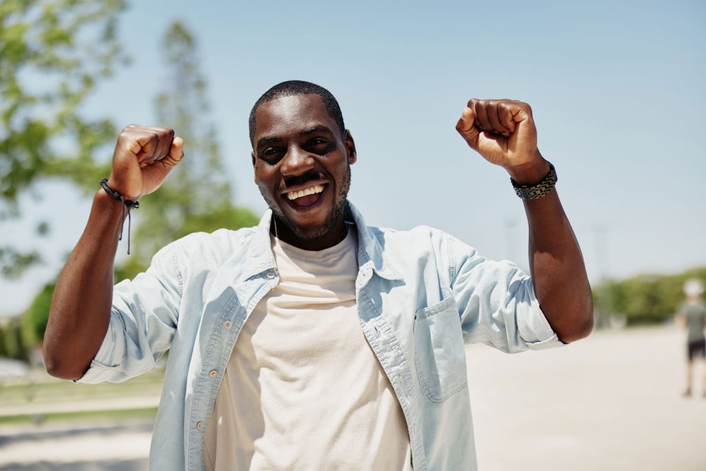 Happy young African man.