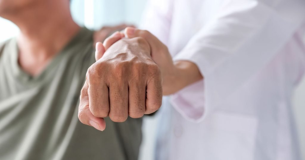 Hands getting stretched by a physician.