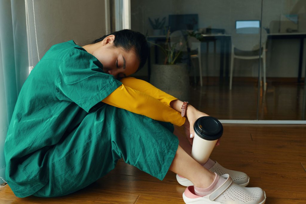 Tired sitting woman.